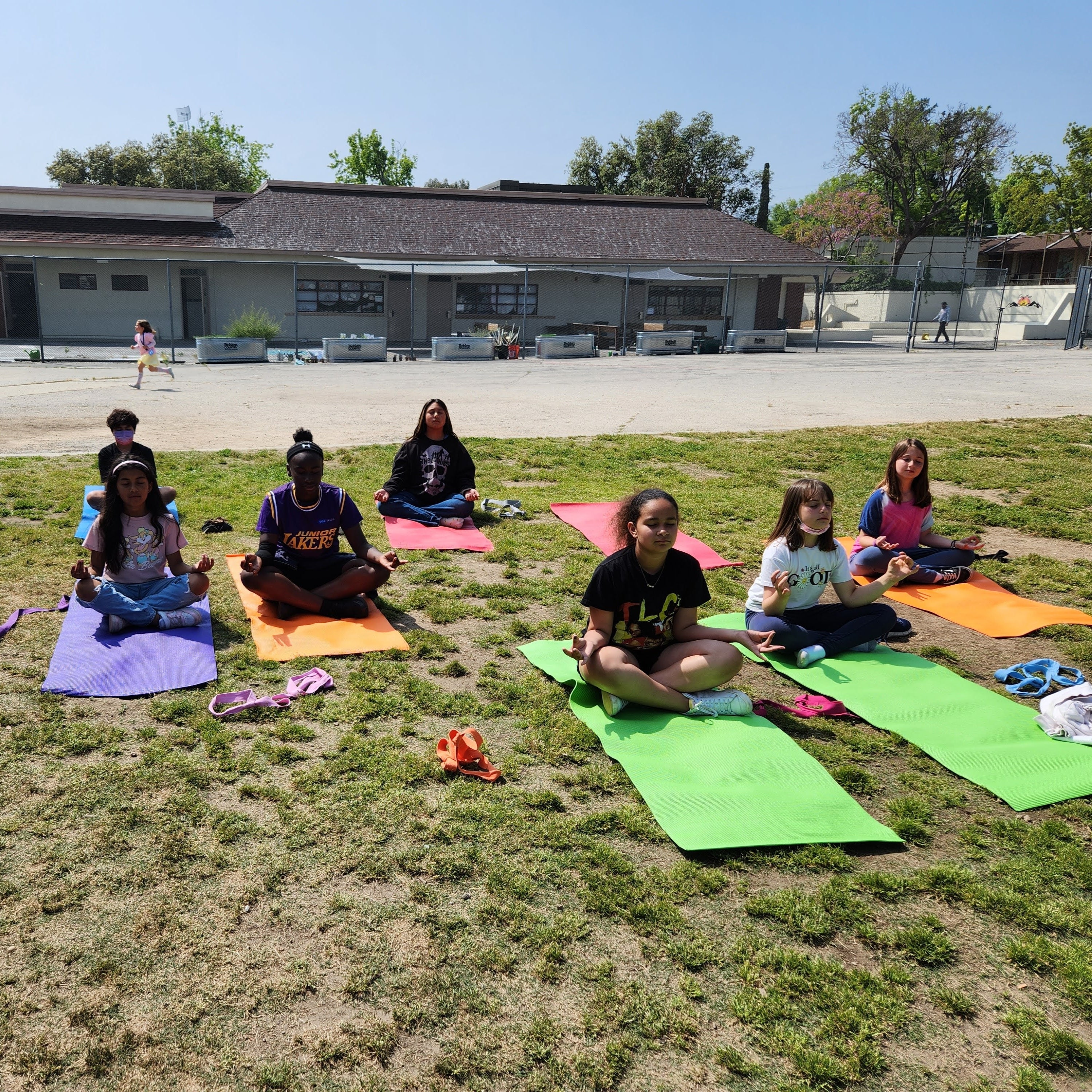 Youth meditating in a safe space, representing hope and recovery through the Boys & Girls Club program for those impacted by the Los Angeles wildfires