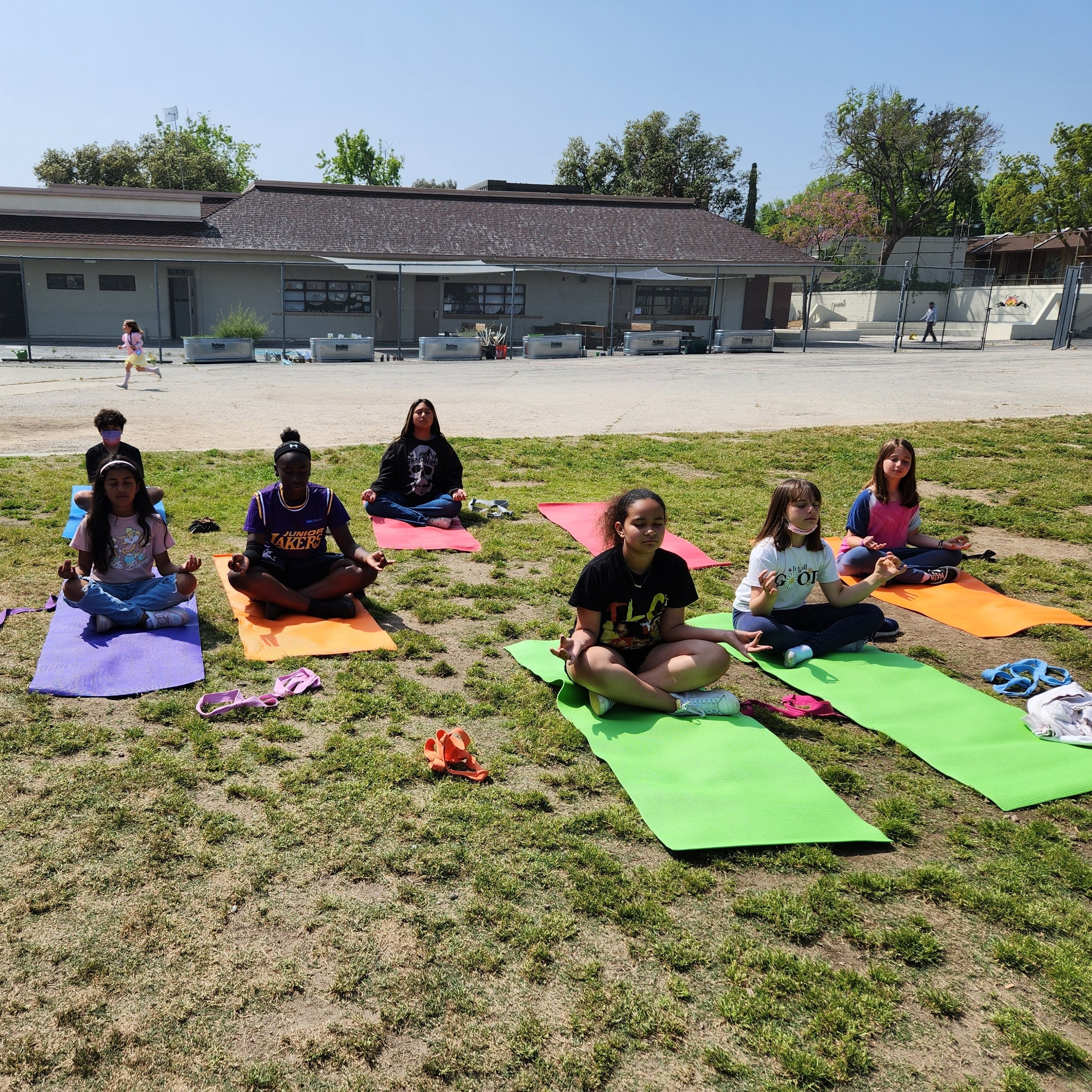 Youth meditating in a safe space, representing hope and recovery through the Boys & Girls Club program for those impacted by the Los Angeles wildfires