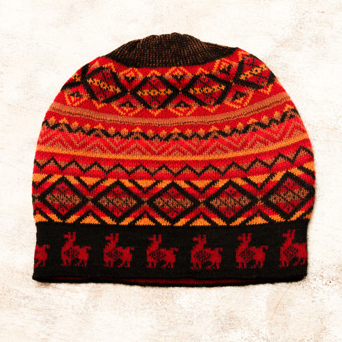 Alpaca Sunrise - a Red and Orange on Black Diamond Motif Alpaca Blend Knit Hat