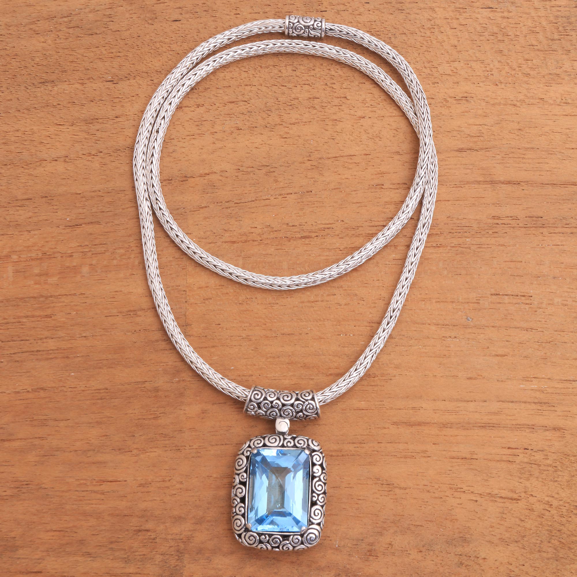 Buddha Curl Memories - a Blue Topaz and Sterling Silver Pendant Necklace from Bali