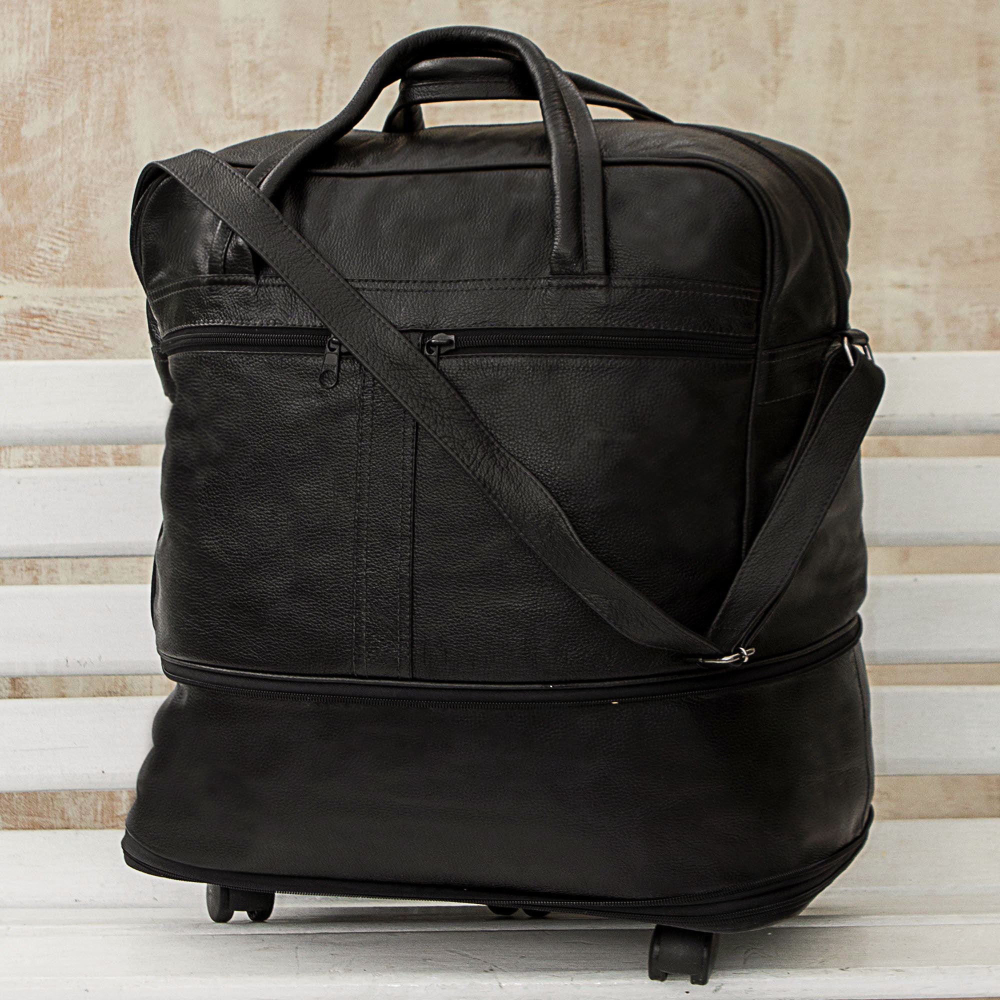 Style Traveler in Black - an Expandable Leather Wheeled Travel Bag in Black from Brazil