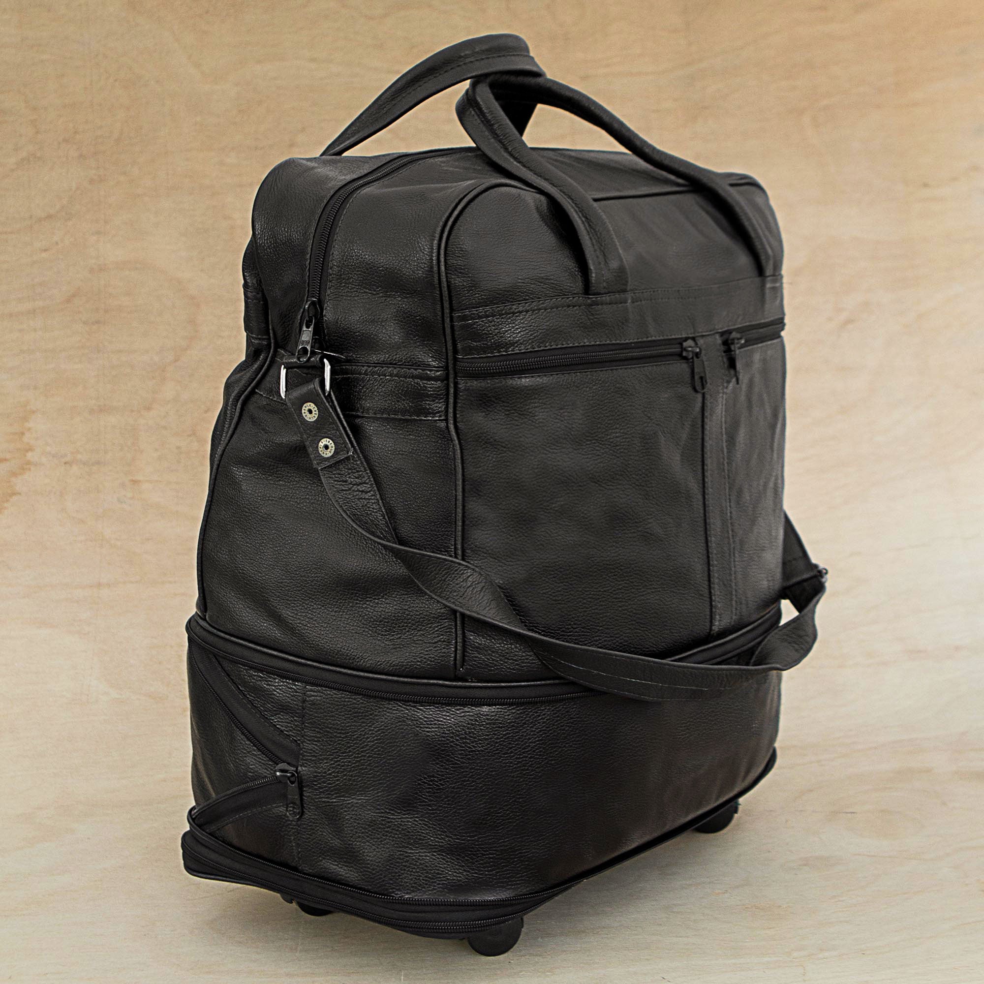 Style Traveler in Black - an Expandable Leather Wheeled Travel Bag in Black from Brazil