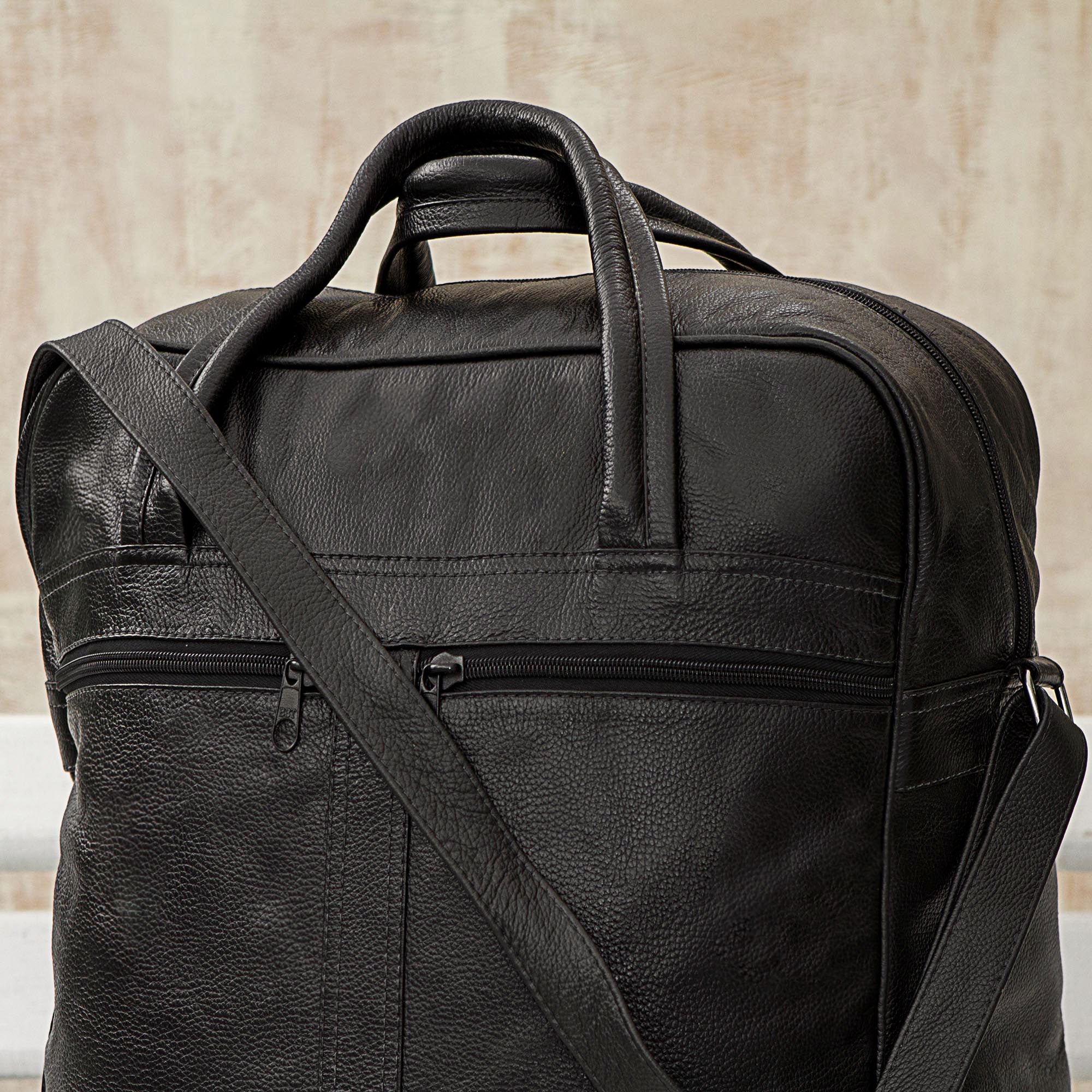 Style Traveler in Black - an Expandable Leather Wheeled Travel Bag in Black from Brazil