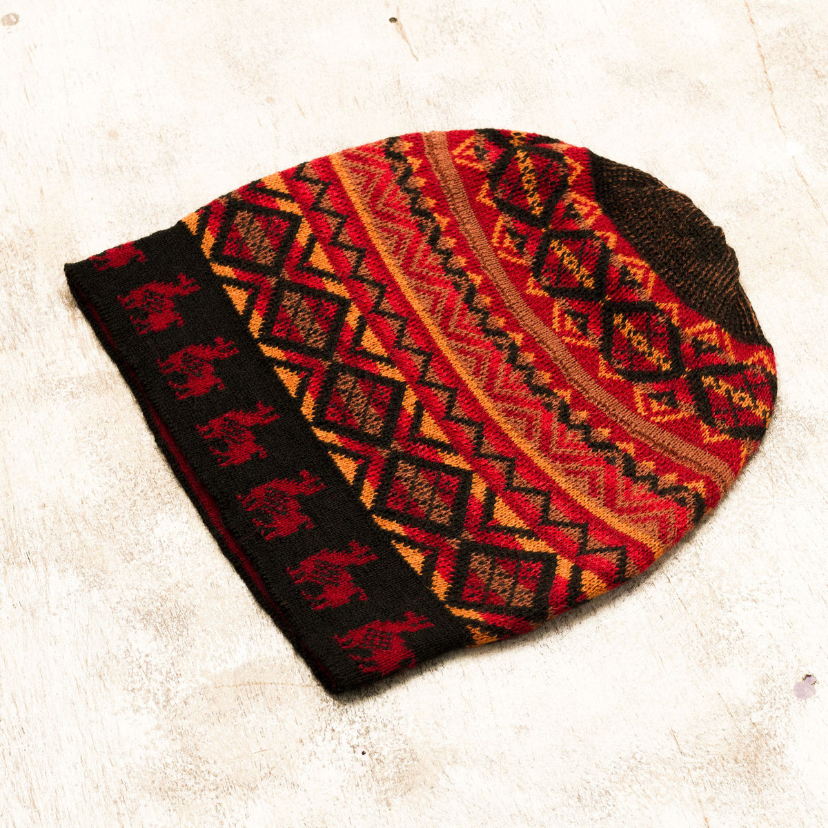 Alpaca Sunrise - a Red and Orange on Black Diamond Motif Alpaca Blend Knit Hat 