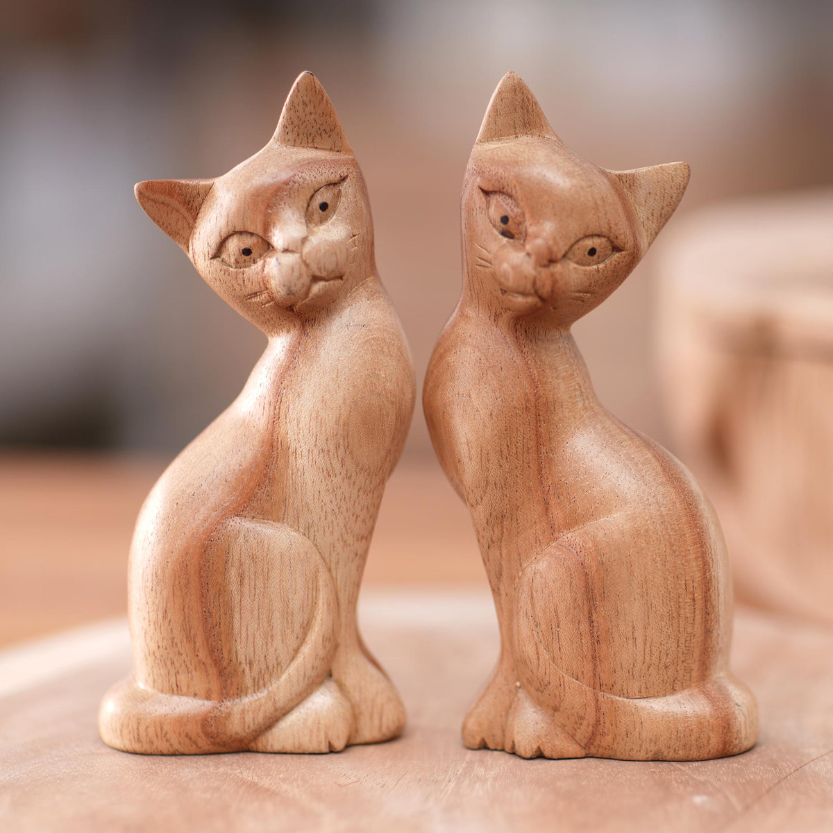 Feline Twins - a Pair of Jempinis Wood Cat Sculptures in Natural Brown