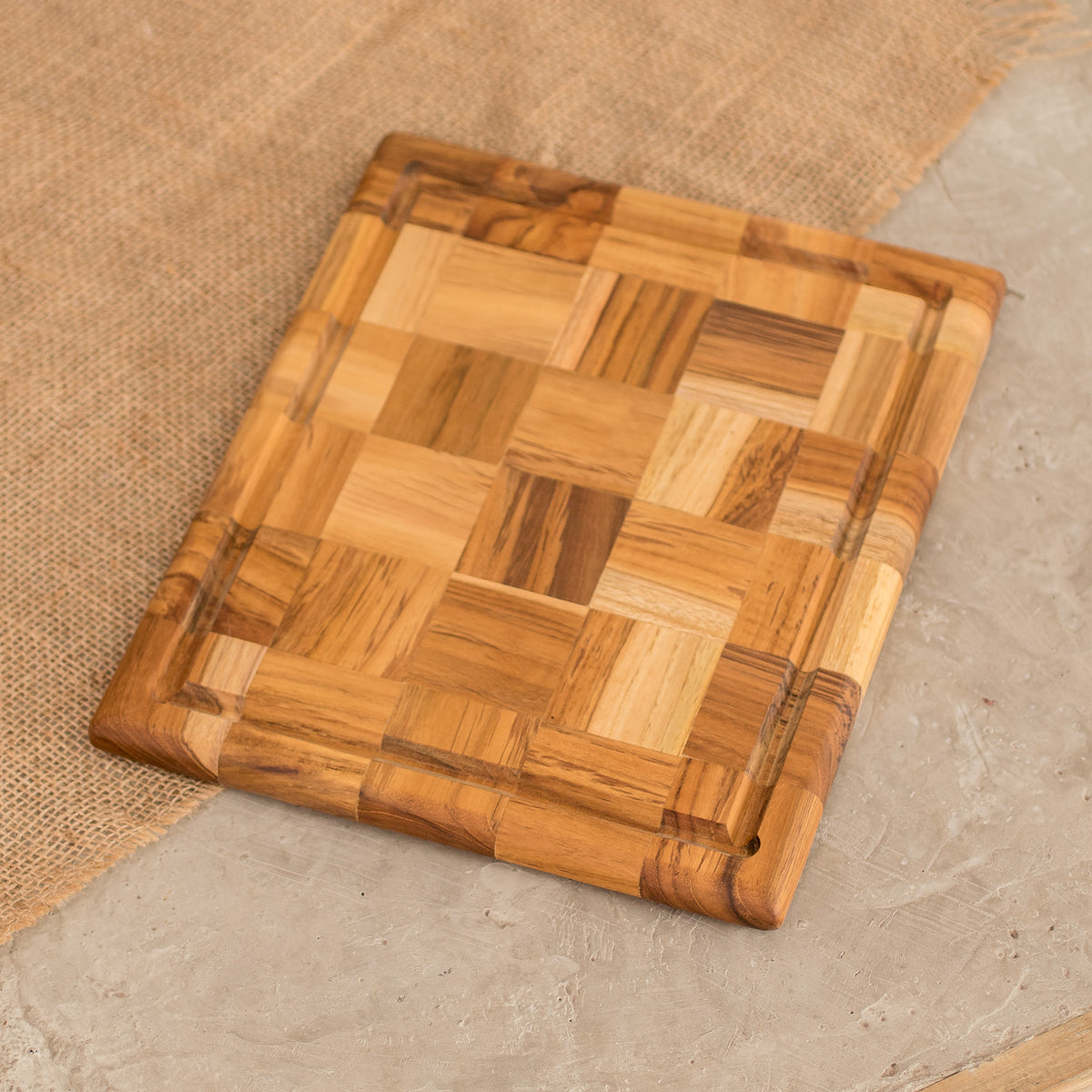Grid Union - a handcrafted and sustainable Rectangular Mosaic Teak Wood Cutting Board from Guatemala