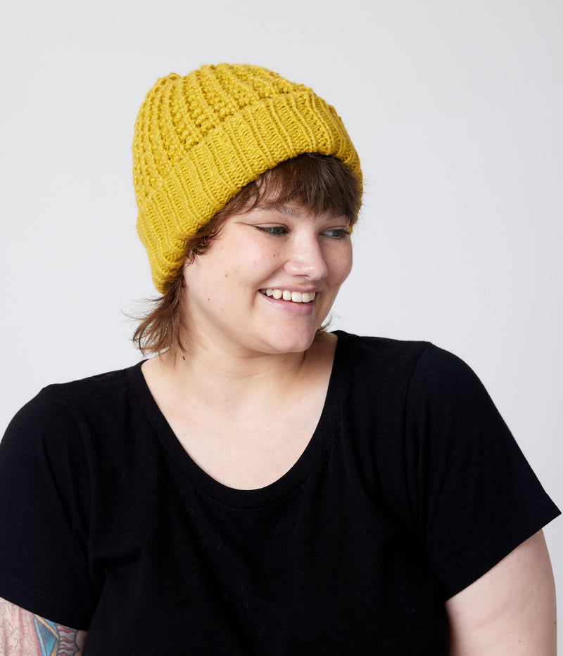 Dijon beanie on model (side)