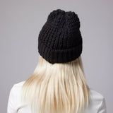 Black beanie on model (rear)