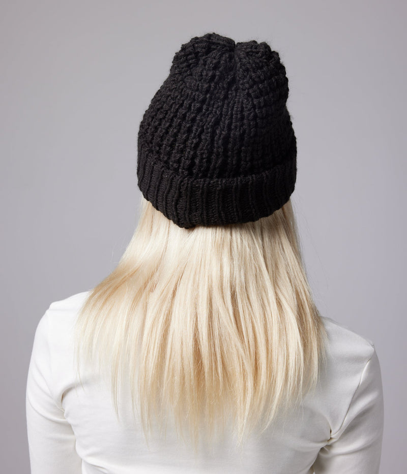 Black beanie on model (rear)