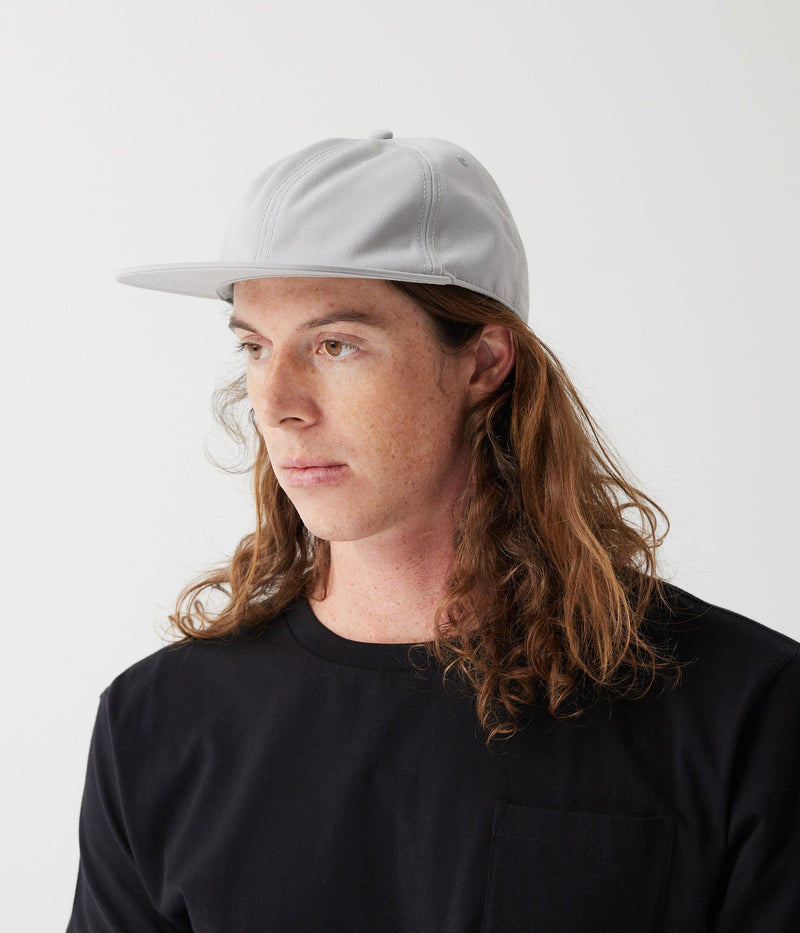 Light grey hat on model (side)