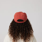 Rust hat on model (rear)