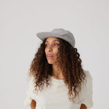 Light grey hat on model