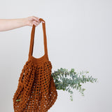 Camel bag with plants inside