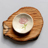 Ring dish on wooden log platter