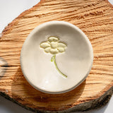 Ring dish on wooden log platter