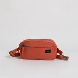 Sustainable organic cotton fanny pack in a burnt orange color