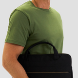 Male model carrying sustainable organic cotton laptop case