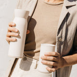 Drink on-the-go with this water bottle and cup all-in-one
